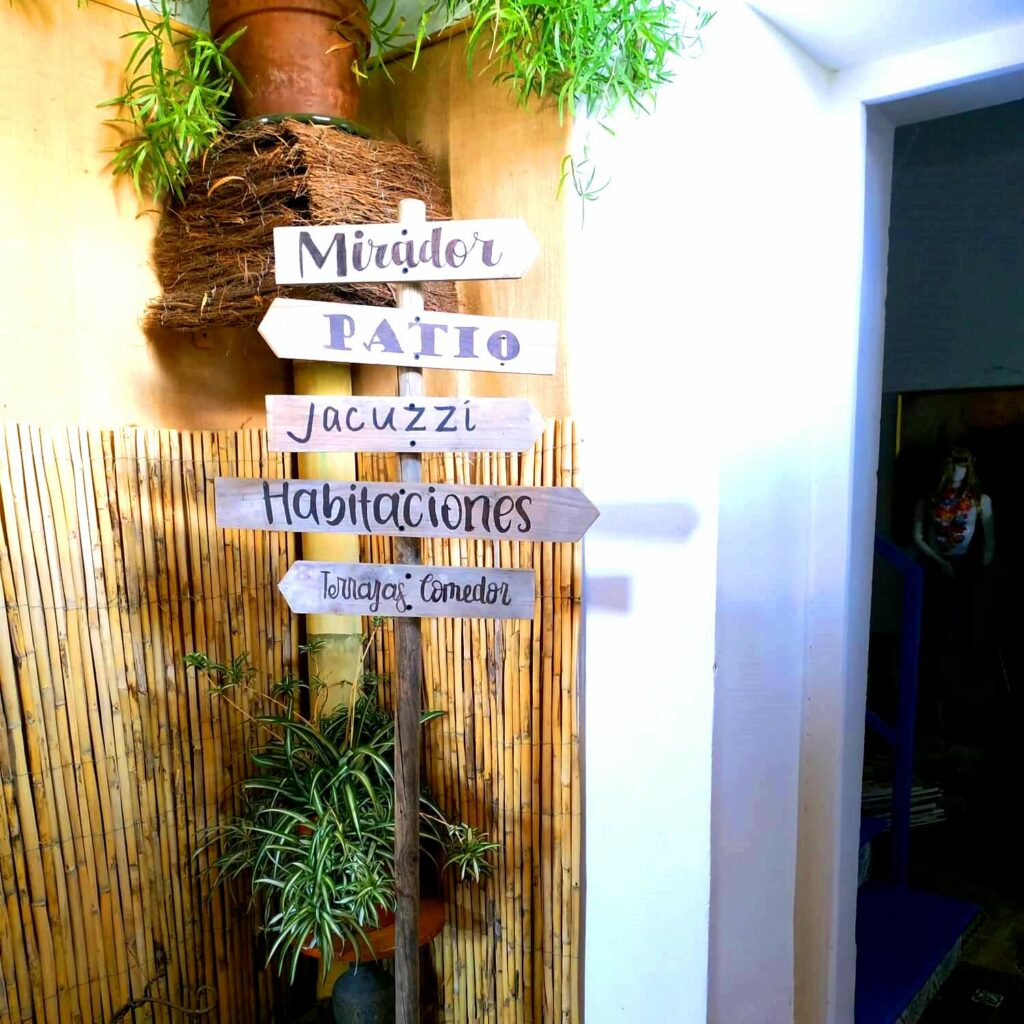 wooden signs indicating places in Spanish